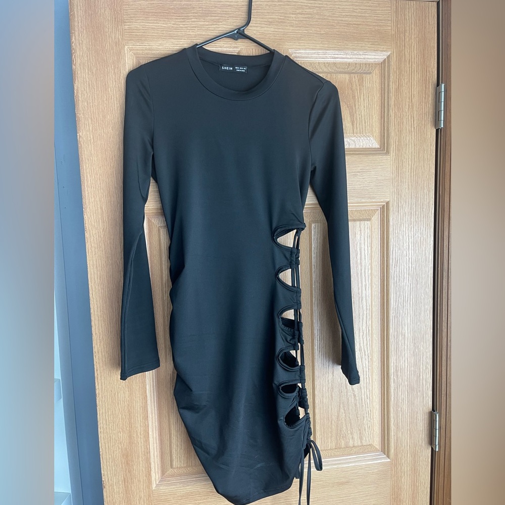 black long sleeve mini dress. size M. open strings on the one side!